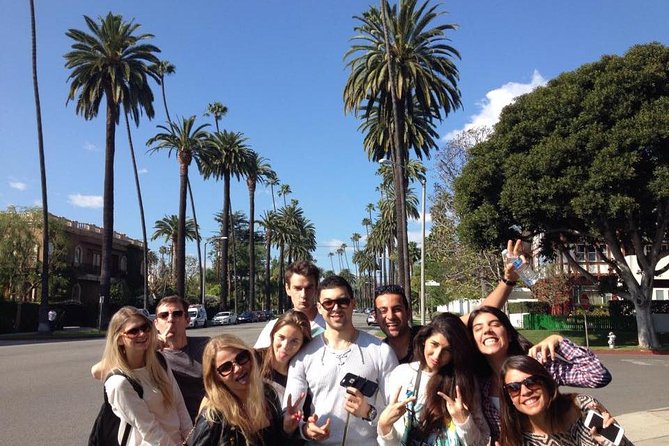 L.A. Highlights Private Full Day Tour of Los Angeles - Venice Beach Boardwalk: street life, Muscle Beach, and canal views