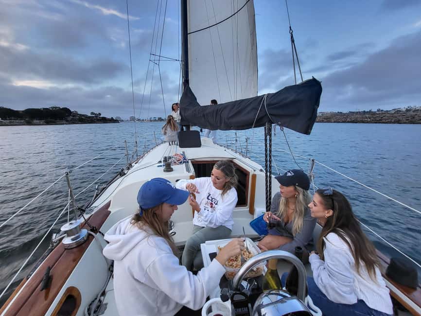 Los Angeles: Sunset Sailing - Steering the helm and handling the sails from the cockpit